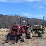 tractor pulling planter