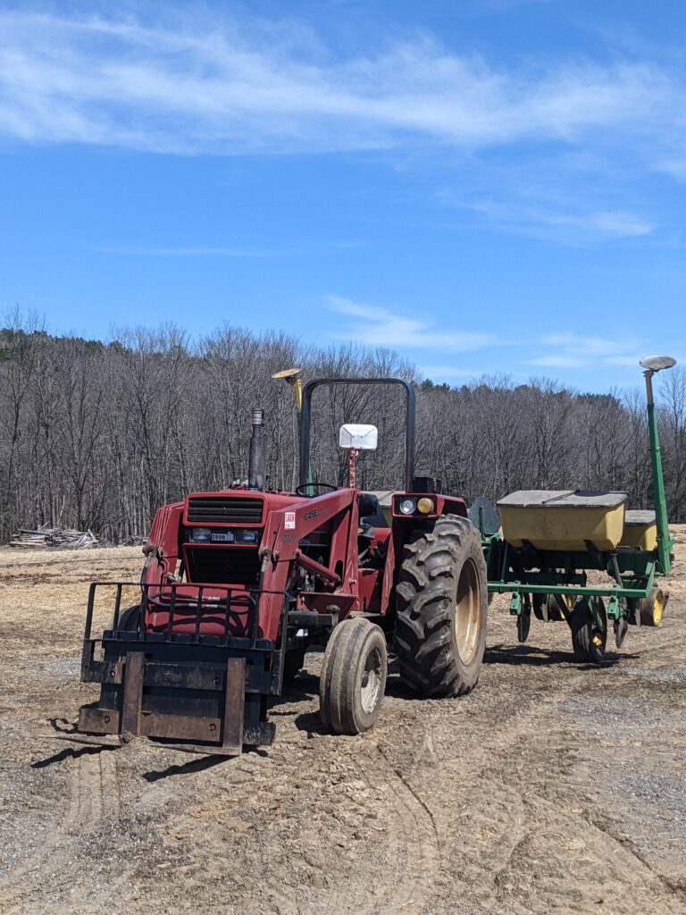 tractor pulling planter