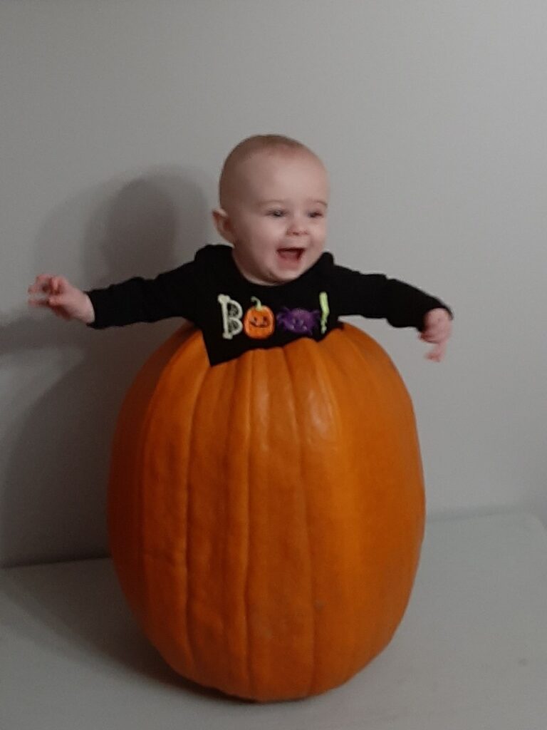 baby in a pumpkin