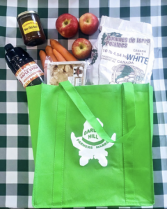 Grocery bag with variety of farmers market items